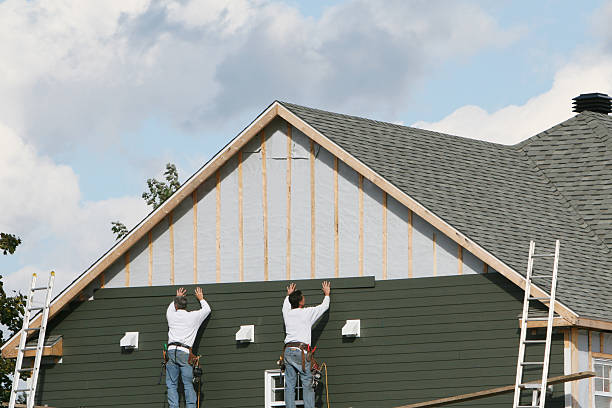 Professional Siding Installation technician working in Elyria, OH